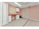Bonus room featuring light pink walls, desk, and tiled floor at 496 Fletcher St, Port Charlotte, FL 33954