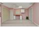 Bonus room featuring desk, light pink walls, and tiled flooring at 496 Fletcher St, Port Charlotte, FL 33954