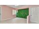 Bonus room featuring light pink walls and accent wall at 496 Fletcher St, Port Charlotte, FL 33954