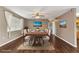 Elegant dining room featuring a large table, stylish decor, and ample natural light at 496 Fletcher St, Port Charlotte, FL 33954