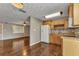 Eat in kitchen with light wood cabinets and wood flooring at 496 Fletcher St, Port Charlotte, FL 33954