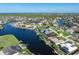 Stunning aerial view of home located on the water with private dock, serene canals, and lush landscaping at 531 Madrid Blvd, Punta Gorda, FL 33950