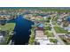 Beautiful aerial showcasing waterfront property with community canals, beautiful blue skies, and lush landscaping at 531 Madrid Blvd, Punta Gorda, FL 33950