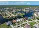 Gorgeous aerial view of waterfront homes with scenic canals in a beautiful neighborhood with lush tropical landscape at 531 Madrid Blvd, Punta Gorda, FL 33950