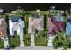 Aerial view of home showing private dock, spacious backyard, swimming pool and lush landscaping at 531 Madrid Blvd, Punta Gorda, FL 33950