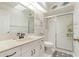 Bathroom featuring decorative fish, a vanity, and a shower with glass doors and attractive design at 531 Madrid Blvd, Punta Gorda, FL 33950