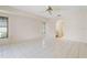 Bright and airy bedroom featuring tile floors, arched entry, and natural light at 531 Madrid Blvd, Punta Gorda, FL 33950