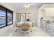 Bright breakfast nook with views, tile floors, and wicker chairs; adjacent to kitchen at 531 Madrid Blvd, Punta Gorda, FL 33950