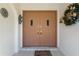 Elegant double front doors with decorative hardware create a grand entry to the home at 531 Madrid Blvd, Punta Gorda, FL 33950