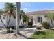 Charming single-story home with well manicured landscaping, a tile roof and an arched entryway at 531 Madrid Blvd, Punta Gorda, FL 33950