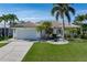 Charming single-Gathering home featuring a well-manicured lawn and attached two-car garage at 531 Madrid Blvd, Punta Gorda, FL 33950