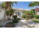 Inviting home featuring stone landscaping, a beautiful walkway, and arched entryway at 531 Madrid Blvd, Punta Gorda, FL 33950