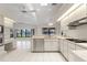 Well-lit kitchen featuring modern appliances, ample counter space, and water views at 531 Madrid Blvd, Punta Gorda, FL 33950