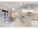 Open kitchen and dining area with tile floors and water views, perfect for entertaining at 531 Madrid Blvd, Punta Gorda, FL 33950