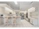 Bright kitchen with white cabinetry, a center island, and stainless steel appliances at 531 Madrid Blvd, Punta Gorda, FL 33950