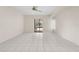 Open living space with tile floors and a large sliding door to an outdoor lanai at 531 Madrid Blvd, Punta Gorda, FL 33950