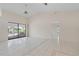 Spacious living room with sliding glass doors leading to the pool and deck, offering serene outdoor views at 531 Madrid Blvd, Punta Gorda, FL 33950