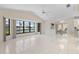 Spacious living room with tile flooring and large windows offering serene water views at 531 Madrid Blvd, Punta Gorda, FL 33950