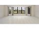 Bright living room with tiled floors, and large windows showcasing waterfront views at 531 Madrid Blvd, Punta Gorda, FL 33950