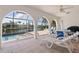 Enclosed patio featuring a relaxing lounge area with views of the canal for serene outdoor living at 531 Madrid Blvd, Punta Gorda, FL 33950
