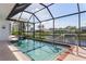Screened-in pool and spa offer privacy and stunning canal views for outdoor relaxation and enjoyment at 531 Madrid Blvd, Punta Gorda, FL 33950