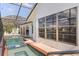 View of screened pool and spa from exterior showcasing the outdoor living space at 531 Madrid Blvd, Punta Gorda, FL 33950