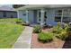 Inviting front entrance with well-maintained landscaping and a charming walkway at 6341 Opa Locka Ln, North Port, FL 34291