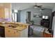 Open concept living space with kitchen view, offering modern appliances and ample counter space at 6341 Opa Locka Ln, North Port, FL 34291