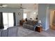 Cozy living room seamlessly connects to the kitchen with open floor plan and comfortable seating at 6341 Opa Locka Ln, North Port, FL 34291