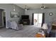 Spacious living room with ceiling fans, modern decor, comfortable seating, and ample natural light at 6341 Opa Locka Ln, North Port, FL 34291