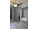 Living room featuring French doors to the exterior and a modern ceiling fan and decorative rug at 6341 Opa Locka Ln, North Port, FL 34291