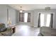 Bright living room featuring neutral paint, ceiling fan, wood-look flooring and comfortable seating at 6341 Opa Locka Ln, North Port, FL 34291