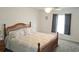 Inviting main bedroom featuring a large bed and a window providing natural light at 6341 Opa Locka Ln, North Port, FL 34291