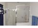 Modern shower stall with glass enclosure and white tiled walls at 6341 Opa Locka Ln, North Port, FL 34291