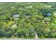 Secluded property on lush lot with mature trees and private pond at 6514 N Biscayne Dr, North Port, FL 34291