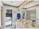Bathroom with views of the backyard pool at 6514 N Biscayne Dr, North Port, FL 34291