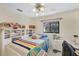 This bedroom features a large window and plenty of space at 6514 N Biscayne Dr, North Port, FL 34291