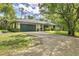 Home exterior with attached two car garage and spacious driveway at 6514 N Biscayne Dr, North Port, FL 34291