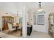Inviting foyer leads to dining room, featuring tile floors and elegant chandelier at 6514 N Biscayne Dr, North Port, FL 34291