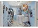 A laundry room features a utility sink and a washing machine at 6514 N Biscayne Dr, North Port, FL 34291