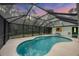 Inviting screened-in pool area perfect for relaxation and entertaining at 6514 N Biscayne Dr, North Port, FL 34291