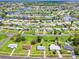 Wide aerial view of a neighborhood on the water, full of single Gathering homes at 6540 Kenwood Dr, North Port, FL 34287