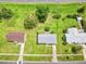 Aerial view of a single-Gathering home with a well-maintained lawn and adjacent properties at 6540 Kenwood Dr, North Port, FL 34287