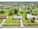 Aerial view of neighborhood featuring a charming single story home and a lawn at 6540 Kenwood Dr, North Port, FL 34287