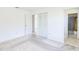 Bright bedroom featuring a closet, bathroom, and access to the living area at 6540 Kenwood Dr, North Port, FL 34287