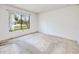 Bedroom with a large window offering abundant natural light and scenic outdoor views at 6540 Kenwood Dr, North Port, FL 34287