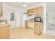 Functional kitchen featuring wooden cabinets and standard appliances at 6540 Kenwood Dr, North Port, FL 34287
