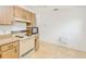 Well-organized kitchen area with standard appliances, lots of cabinets, and an efficient layout for easy meal preparation at 6540 Kenwood Dr, North Port, FL 34287