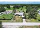 An aerial view of the home with a covered carport near a quiet street at 8513 Heister St, Punta Gorda, FL 33982