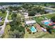 A high angle shot of the house and pool in a neighborhood near a lake at 8513 Heister St, Punta Gorda, FL 33982